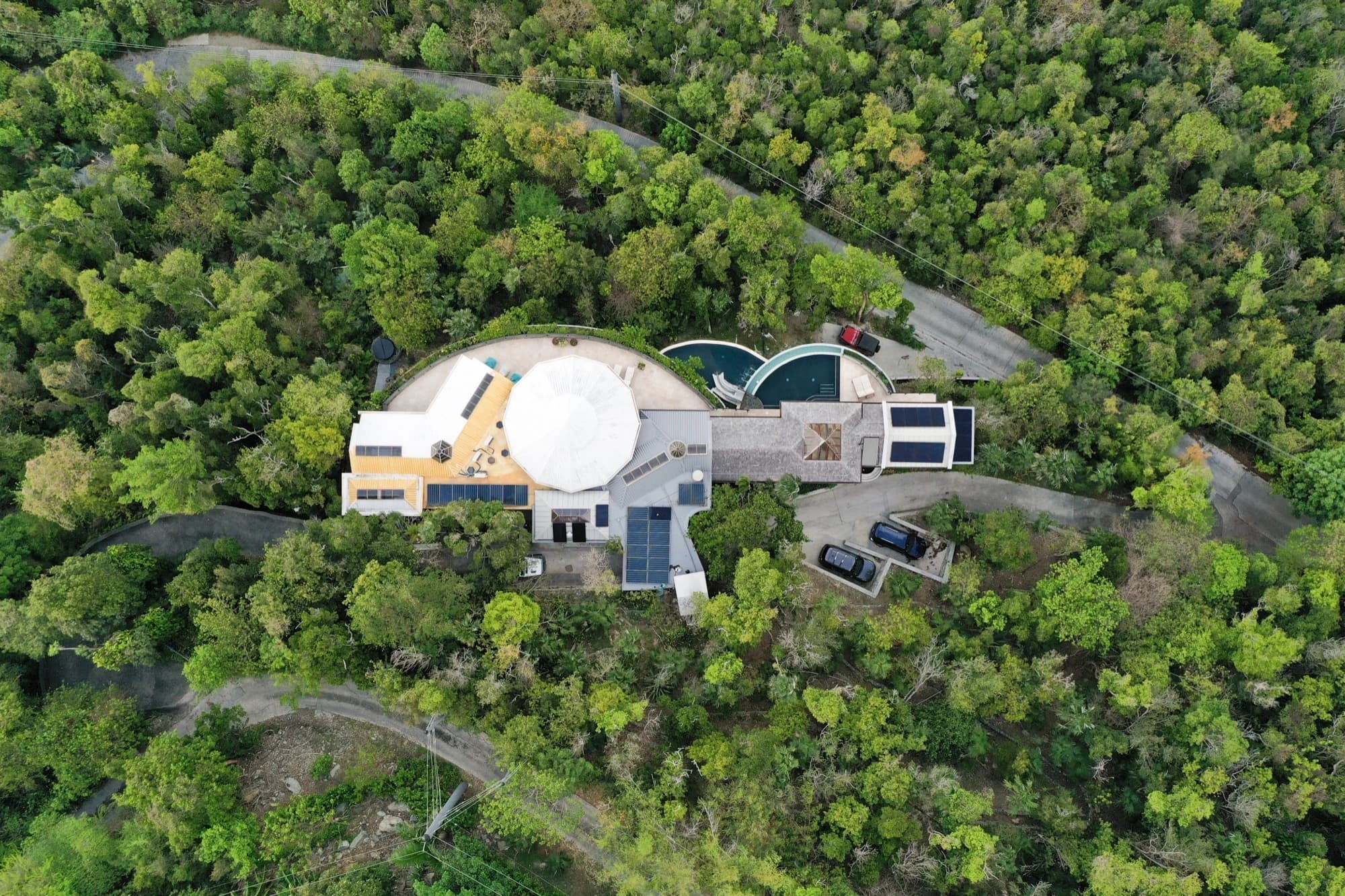 Drone shot of Valhalla St John showing pools and stone architecture from above
