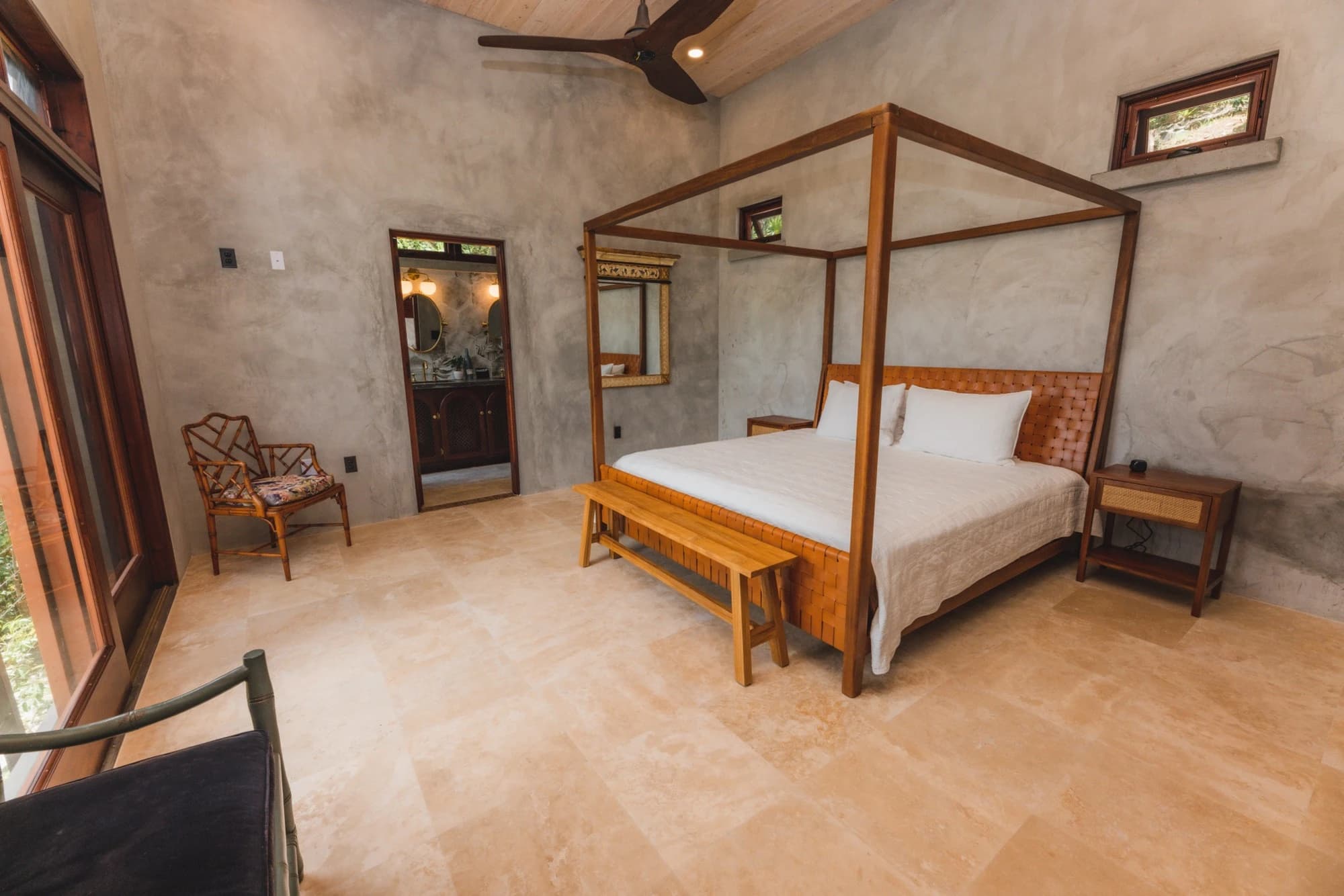 Lower-level suite with four-poster canopy bed at Valhalla St John villa