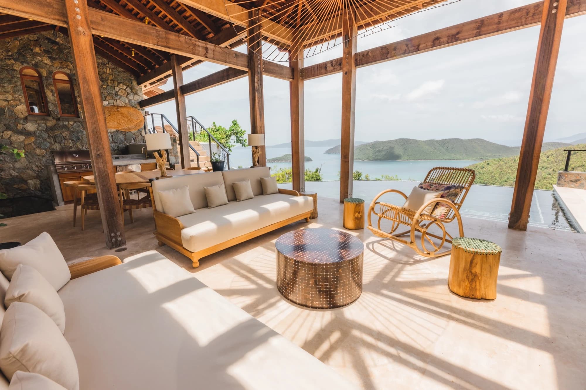 Outdoor lounge with sofas and ocean view at Valhalla St John, St. John USVI