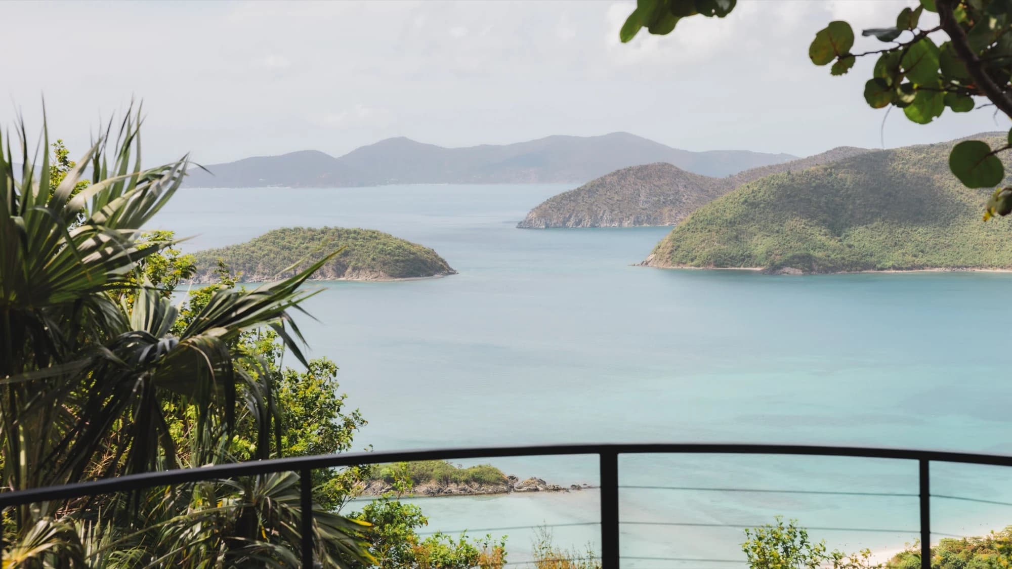 Cinnamon Bay panorama through tropical plants from Valhalla St John veranda