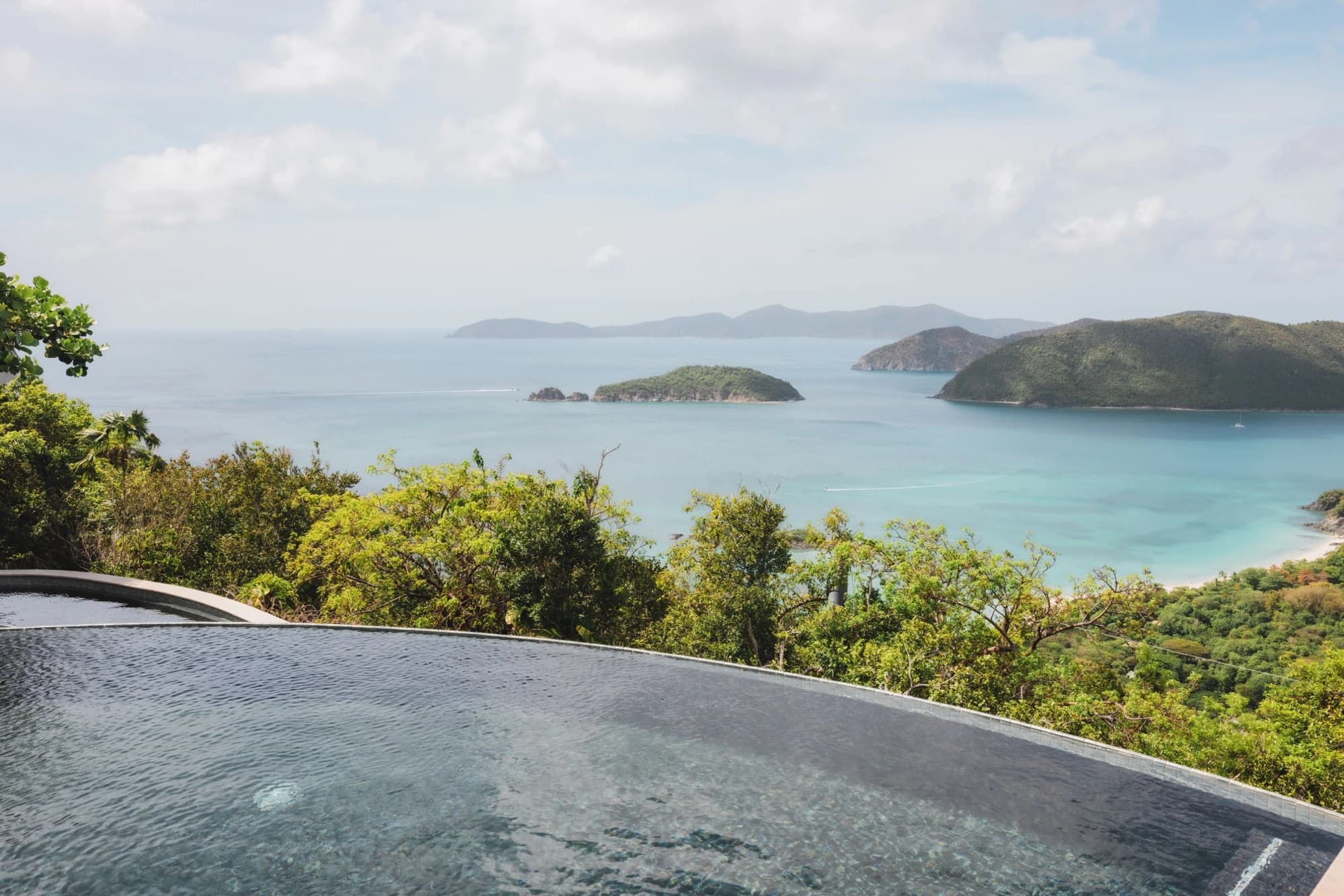 Infinity pool edge with Cinnamon Bay below at Valhalla St John