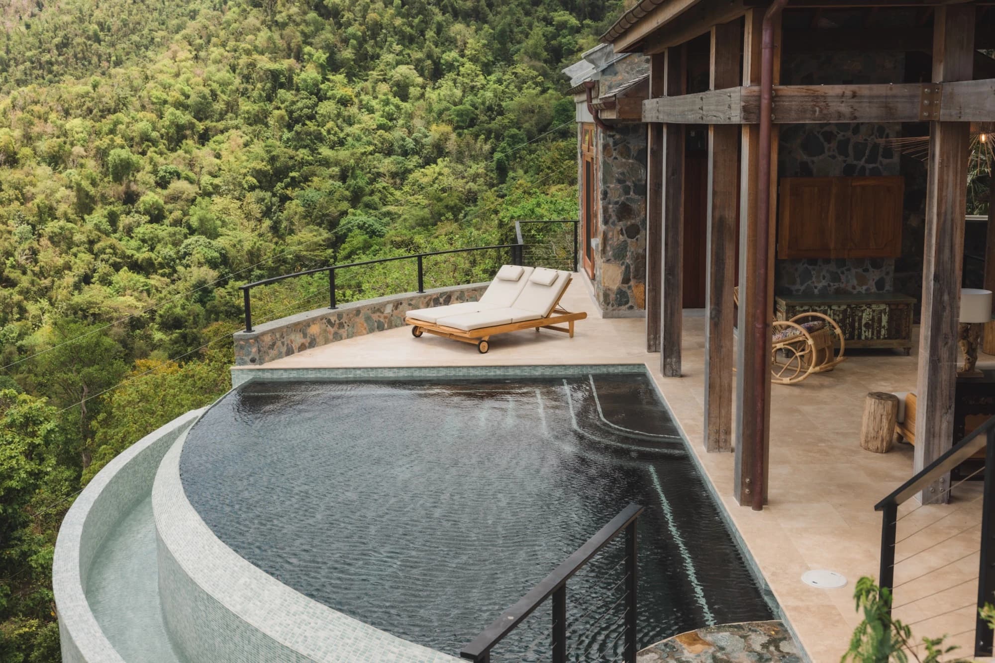 Pool area with slide and loungers at Valhalla St John villa, St. John USVI